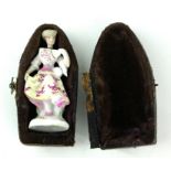 A 19TH CENTURY CONTINENTAL PORCELAIN MINIATURE FIGURAL SCENT BOTTLE Maiden wearing period attire,