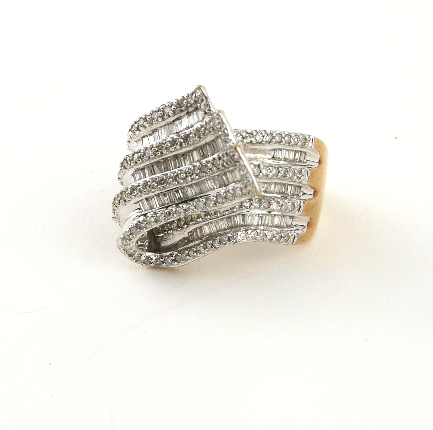 AN 18CT WHITE GOLD BAGUETTE CUT AND PAVÉ SET DIAMOND TWIRL RING, CIRCA 1970 (size L½). - Image 3 of 4