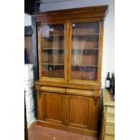 A VICTORIAN MAHOGANY BOOKCASE The two glazed doors enclosing shelves above two drawers and