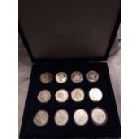 A COLLECTION OF SILVER WORLD AT WAR PROOF COINS Comprising seven twenty crown coins, four one