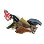 A COLLECTION OF BRITISH MILITARY PISTOL HOLSTERS AND REGALIA Three brown leather and one canvas with