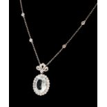 AN 18CT WHITE GOLD, AQUAMARINE AND DIAMOND PENDANT NECKLACE The oval cut aquamarine edged with