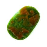 A CHINESE JADE CARVED OVAL PENDANT Carved with a dragon and horse within stylised clouds. Condition: