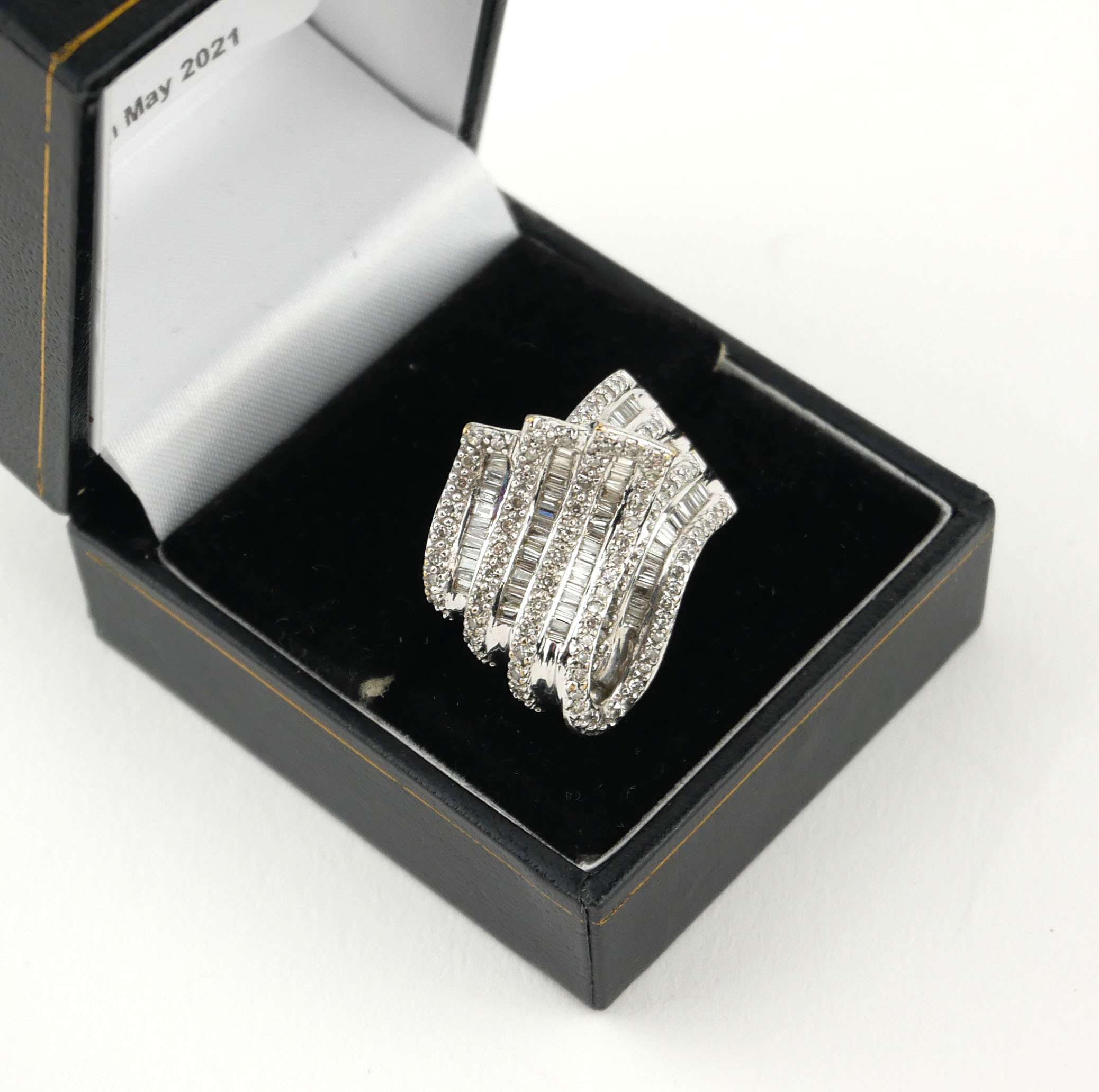 AN 18CT WHITE GOLD BAGUETTE CUT AND PAVÉ SET DIAMOND TWIRL RING, CIRCA 1970 (size L½). - Image 4 of 4