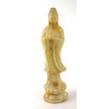 A CHINESE SOAPSTONE CARVING OF GUANYIN Standing pose, on a double lotus base. (approx 20cm)