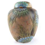 CROWN DEVON, AN ART DECO POTTERY GINGER JAR AND COVER Decorated with green and blue flowers,