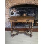 A WILLIAM AND MARY DESIGN OAK SIDE TABLE Having a single drawer, raised on barley twist supports