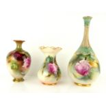 ROYAL WORCESTER, A COLLECTION OF THREE EARLY 20TH CENTURY PORCELAIN VASES Each hand painted with