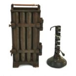 AN 18TH CENTURY IRON RUSH LIGHT HOLDER ON WOODEN BASE Along with a cast iron eight section candle