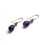 A PAIR OF 9CT GOLD, SILVER AND PEAR CUT AMETHYST DROP EARRINGS (3cm) Condition: good