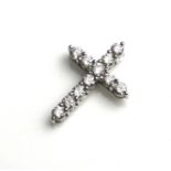 A 9CT WHITE GOLD AND ROUND CUT DIAMOND CRUCIFIX. (approx diamond weight 1ct, 2.2cm x 1.7cm)