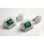 A PAIR OF EDWARDIAN DESIGN 18CT WHITE GOLD, PRINCESS CUT EMERALD AND DIAMOND DROP EARRINGS. (