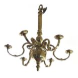 A 17TH CENTURY DESIGN HEAVY BRASS SIX BRANCH CHANDELIER With faceted column and scrolling arms. (