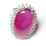 AN 18CT WHITE GOLD AND CABOCHON CUT BURMESE RUBY AND DIAMOND DRESS RING (size N). (approx Burmese