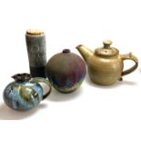 A COLLECTION OF STUDIO POTTERY Including a teapot, small jug and, some signed and monogrammed.