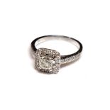 AN ART DECO STYLE 18CT WHITE GOLD AND DIAMOND HALO RING The central Princess cut stone surrounded by