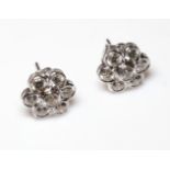 A PAIR OF 18CT WHITE GOLD AND DIAMOND DAISY EARRINGS. (total diamond weight 3ct, 1.4cm) Condition: