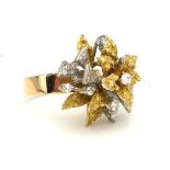 A 14CT GOLD AND DIAMOND DRESS RING OF ORGANIC FORM (size Q). (11.1g)
