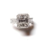 AN 18CT WHITE GOLD AND BAGUETTE CUT DIAMOND HALO RING Flanked by diamond shoulders (size M). (approx