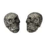 A PAIR OF UNUSUAL LIFE SIZE LEAD AND GLASS SKULL LAMPS. (h 19cm x d 25cm x w 17cm)