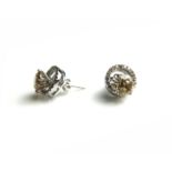 A PAIR OF 18CT WHITE GOLD HALO AND DIAMOND EARRINGS (approx diamond weight 3.51ct) Condition: good