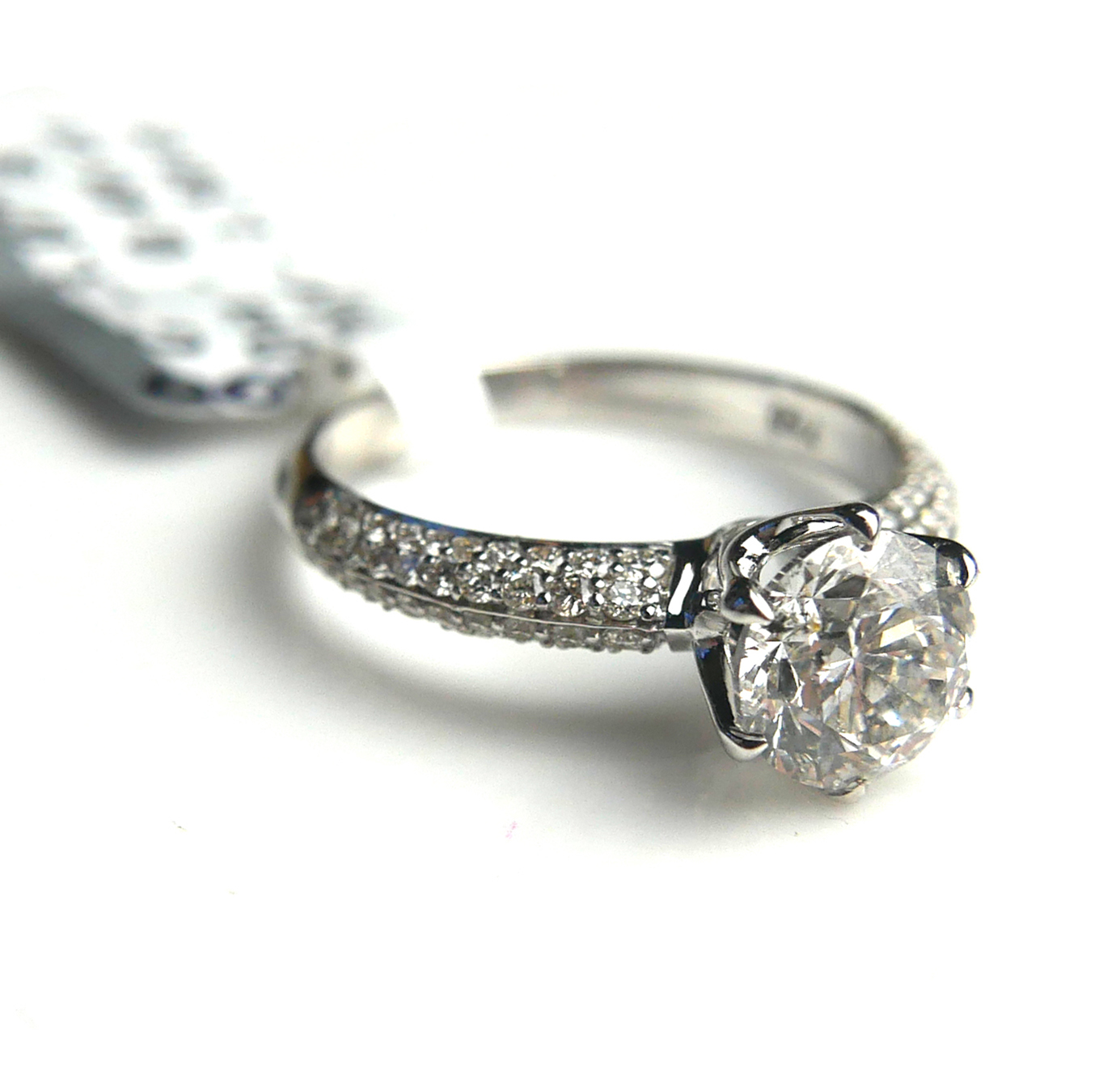AN 18CT WHITE GOLD AND DIAMOND SOLITAIRE RING Flanked by diamonds shoulders (size M). (approx - Image 2 of 2
