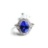 AN 18CT WHITE GOLD, TANZANITE AND DIAMOND RING (size O). (approx tanzanite weight 3.8ct)