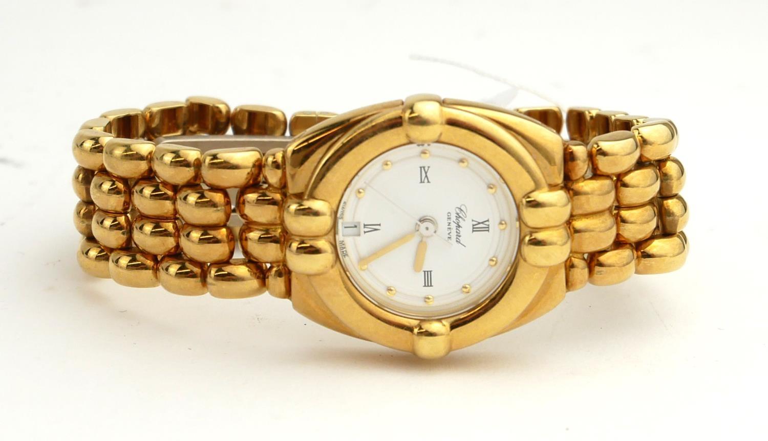 CHOPARD, AN 18CT GOLD LADIES' BRACELET WATCH. (83.2g)