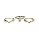 AN 18CT WHITE GOLD AND MARQUISE CUT DIAMOND SOLITAIRE RING WITH MATCHING SIDE RINGS The single