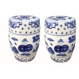 A PAIR OF CHINESE PORCELAIN BLUE AND WHITE GARDEN SEATS Each decorated with Oriental view and