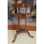 A 19TH CENTURY MAHOGANY SHAVING STAND The circular dish top above a single drawer, raised on three