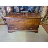 AN 18TH CENTURY OAK MULE CHEST The rise and fall top above two drawers, fitted with brass escutcheon