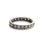 A WHITE METAL AND OLD CUT DIAMOND FULL ETERNITY RING (size P). (approx diamond weight 1.33ct,