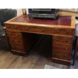 A VICTORIAN MAHOGANY TWIN PEDESTAL DESK With maroon told leather surface above an arrangement of
