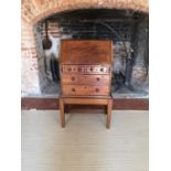 A GEORGIAN AND LATER CHILDS MAHOGANY WRITING BUREAU The fall front enclosing a fitted interior above