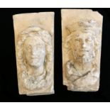 A PAIR OF PORTLAND STONE CORBELS CARVED WITH MEDIEVAL FACIAL MASKS. (17cm x 24cm x 31cm)