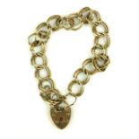 A VINTAGE 9CT GOLD BRACELET Having pierced circular links and heart form clasp. (approx 18cm)