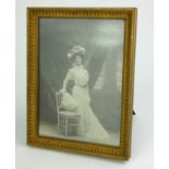 LIBERTY & CO., LONDON AND PARIS, AN EDWARDIAN PERIOD GILTWOOD TABLE PHOTOGRAPH FRAME Having original