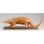 A LATE 19TH CENTURY TAXIDERMY PANGOLIN UPON AN OAK BASE. Provenance: From a deteriorated Victorian