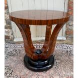 A PAIR OF STYLISH ART DECO LACQUERED WALNUT CIRCULAR SIDE TABLES With four swept supports