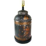 AN ANTIQUE TOLEWARE TEA CANISTER LAMP Decorated with chinoiserie figures near a harbour on black