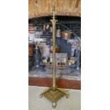 A BRASS ADJUSTABLE STANDARD LAMP With Corinthian capital on a fluted column and platform base