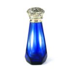 A STERLING SILVER AND OVERLAID GLASS SCENT BOTTLE The silver cap opening to reveal a gold plated
