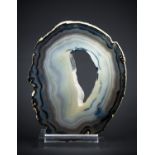 AN AGATE SLICE MOUNTED ON A CUSTOM ACRYLIC DISPLAY STAND, BRAZIL (h 32cm x w 25cm x d 7cm)