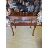 AN 18TH CENTURY MAHOGANY SILVER TABLE The dished top above a shaped apron, on cabriole legs with