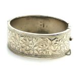 AN EARLY 20TH CENTURY SILVER BANGLE Having engraved decoration, hallmarked Birmingham, 1935. (approx