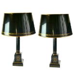 A PAIR OF REGENCY STYLE TOLEWARE TABLE LAMPS AND SHADES With gilt floral decoration, on a black