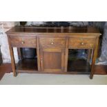 A 19TH CENTURY OAK DRESSER With three drawers above a central cupboard, on square legs. (152cm x