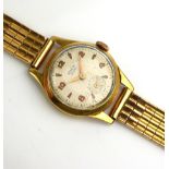 A VINTAGE 18CT GOLD LADIES' WRISTWATCH The round ivory tone dial having Arabic number markings and