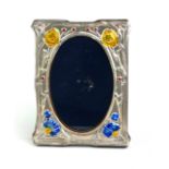 AN ART NOUVEAU DESIGN SILVER AND ENAMEL PHOTOGRAPH FRAME Organic form decoration, wooden easel back,